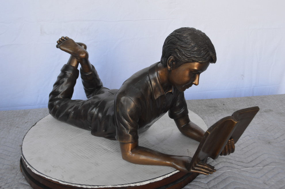 A Set of Boy and Girl Reading Books Bronze Statue -  Size: 31"L x 10"W x 14"H.