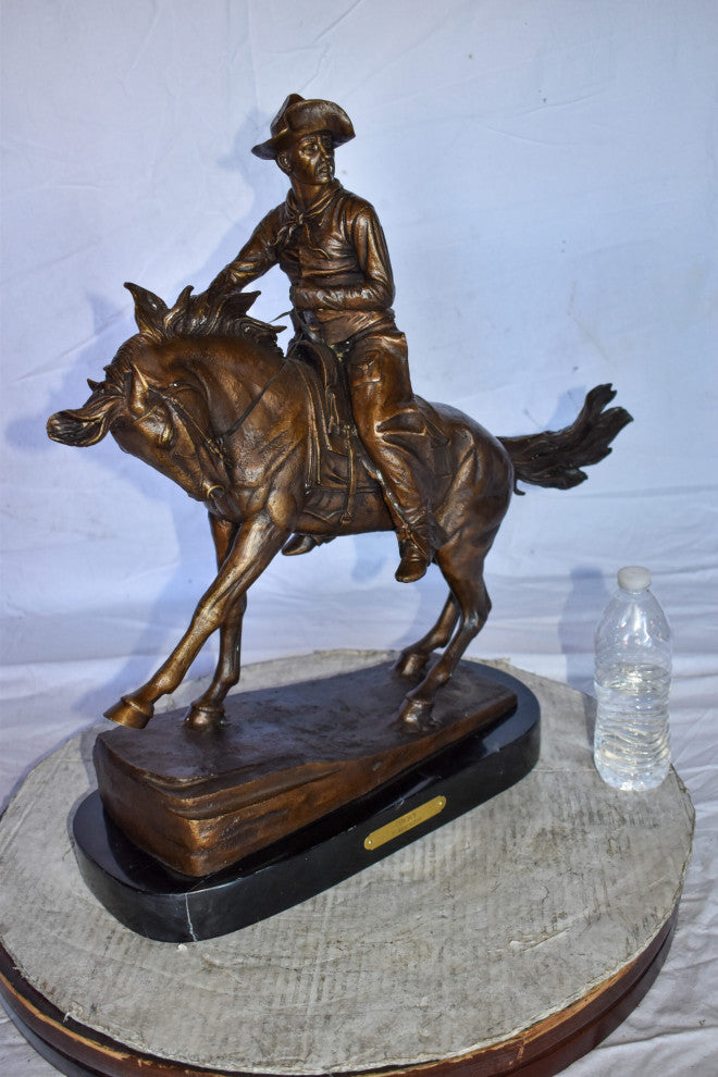 Cowboy Remington Replica Bronze Statue on Triple Marble Size: 25" x 8" x 24"H