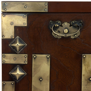 Close-up of corner hardware on white background; cropped.