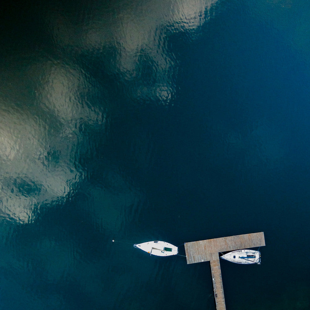 "White Boats Calm Lake" Print by Karolis Janulis