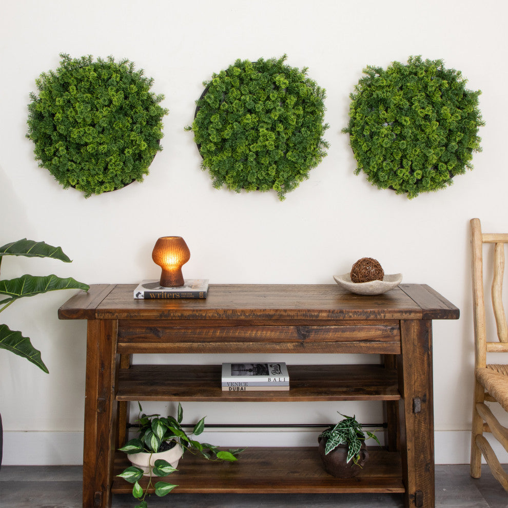 Lifestyle: three moss panels displayed on wall as decor in a room.