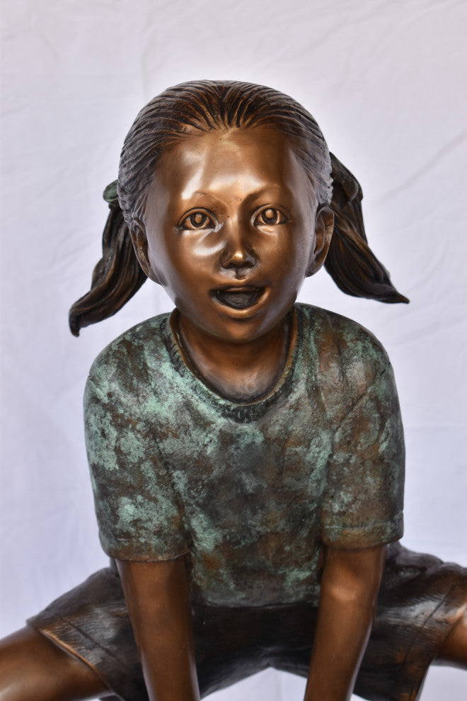 Two Girls Playing Leapfrog Jumping Bronze Statue Size: 30"L x 14"W x 34"H.