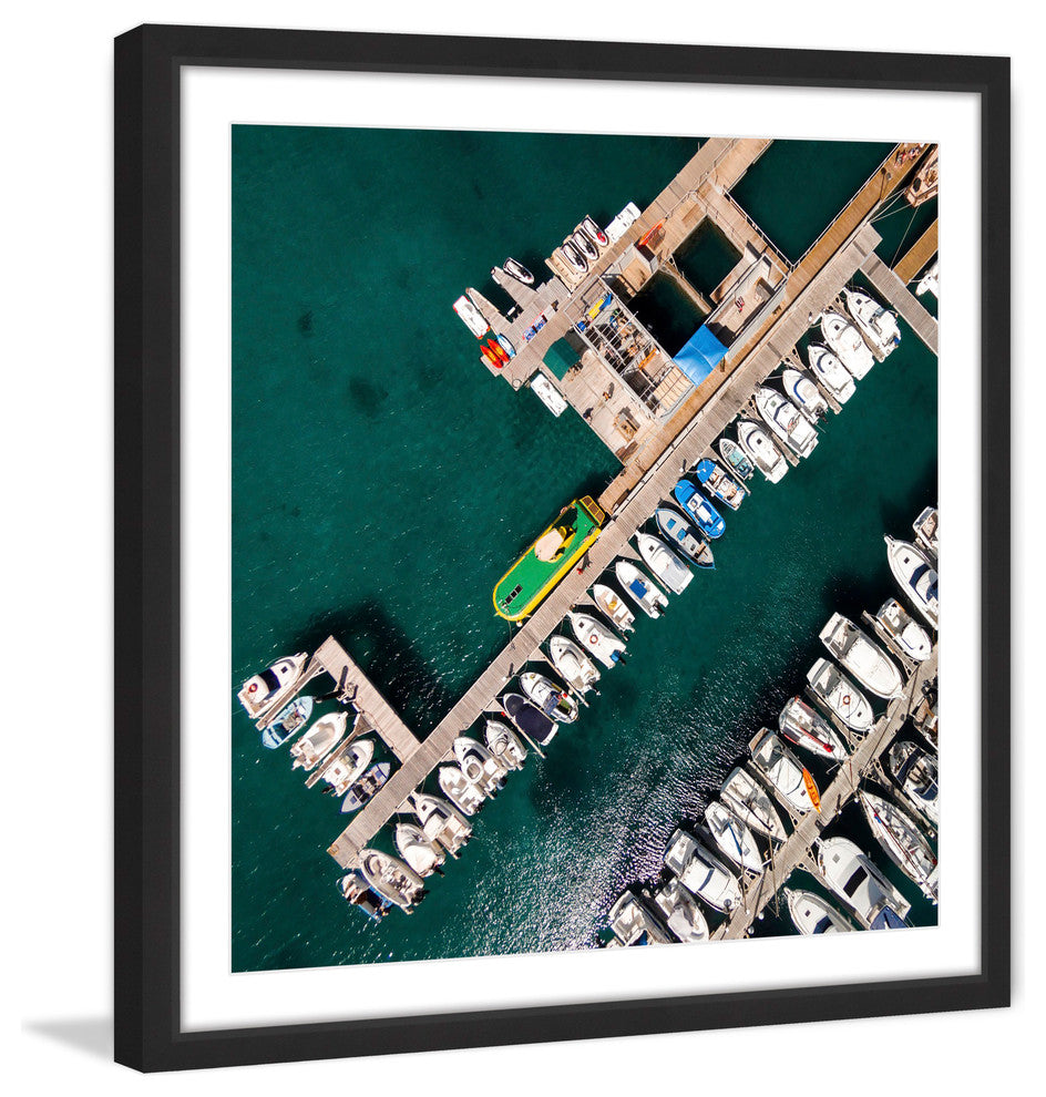 "Neatly Docked Boats" Framed Print by Karolis Janulis
