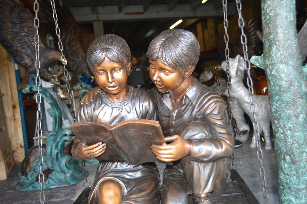 Kids on Swing Set Reading a Book Life Size Bronze Statue -  50"L x 40"W x 70"H
