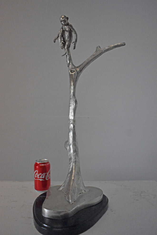 Monkey Resting on a Tree Silver Finish Bronze Statue - Size: 12" x 13" x 27"H.