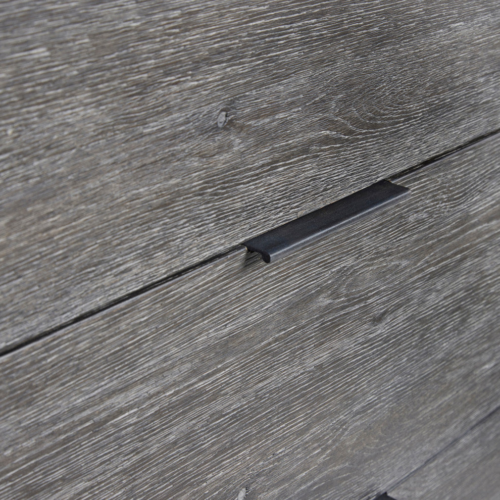Close-up of wood grain and drawer handle on white background.