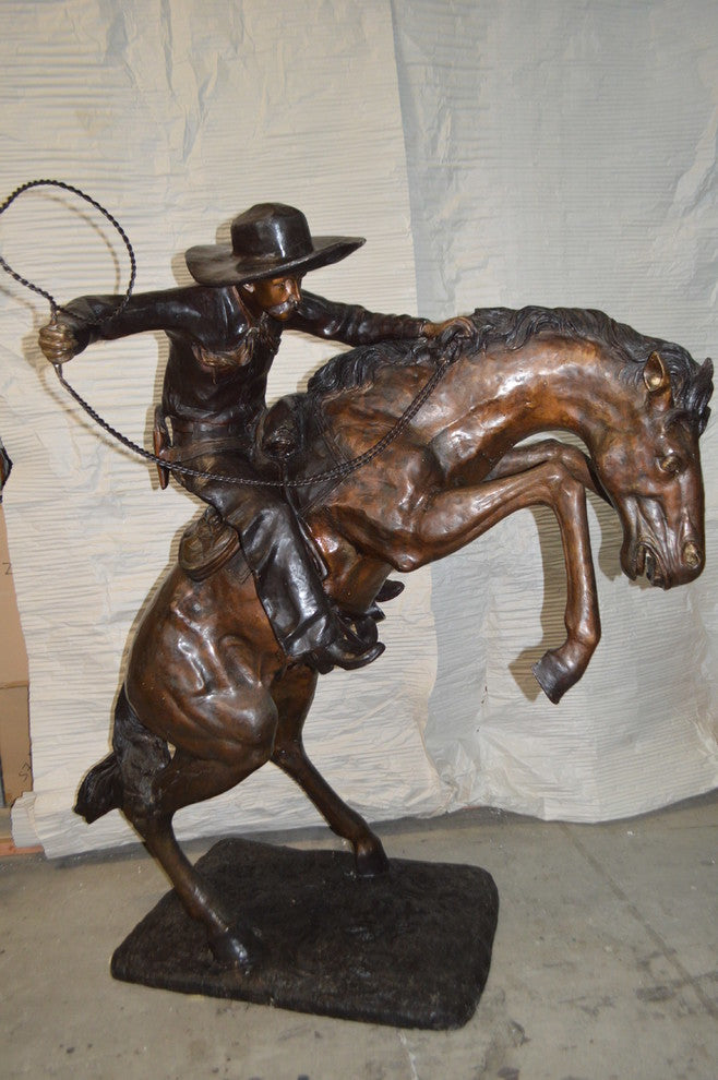 Bronco Buster Giant Bronze Statue -  Size: 65"L x 52"W x 64"H.