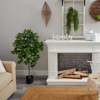 Lifestyle scene showing the tree in a real room with decor; full product visible.