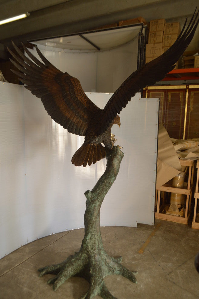 Landing Eagle on a Tree Giant Bronze Statue -  Size: 72"L x 36"W x 88"H.