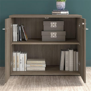 Product in lifestyle setting with doors/open sections showing internal storage.
