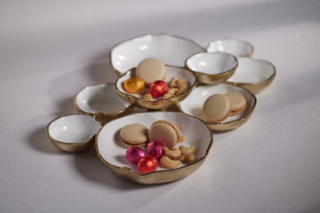 Cluster of Nine Round Serving Bowls With White Enamel Interior, Gold