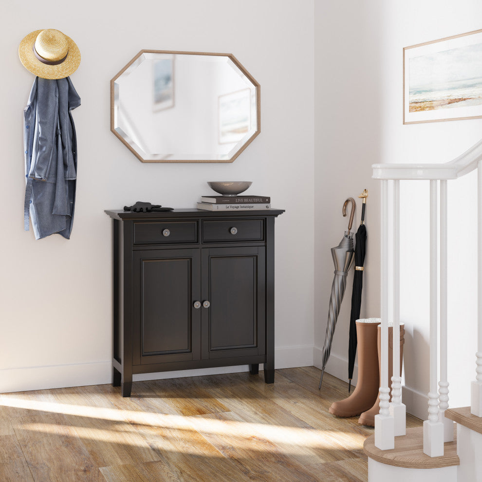 Lifestyle photo: cabinet placed in entryway with mirror and accessories.