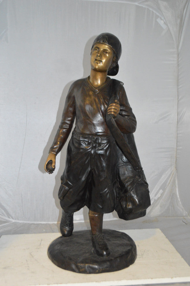 Boy Carrying A Golf Bag Bronze Statue -  Size: 15"L x 15"W x 38"H.