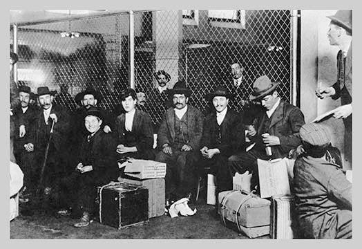 Immigrant Men Sitting at Ellis Island- Framed Paper Poster 20" x 30"