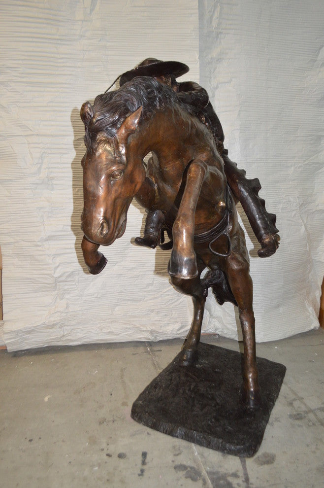 Bronco Buster Giant Bronze Statue -  Size: 65"L x 52"W x 64"H.