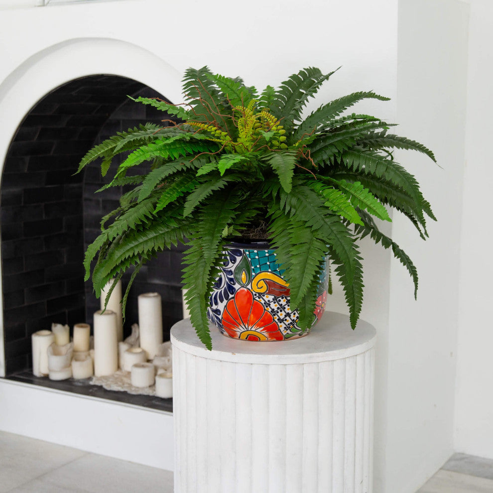 Lifestyle shot with plant and pot in interior setting; full product visible.
