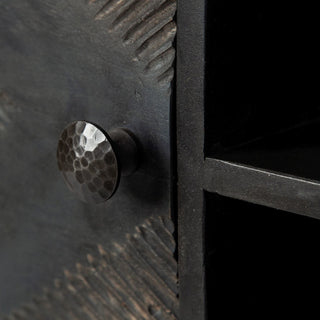 Close-up of knob and textured surface; cropped view of a feature (detail shot).