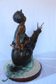 Happy boy riding a snail bronze statue fountain -  Size: 42"L x 14"W x 34"H.