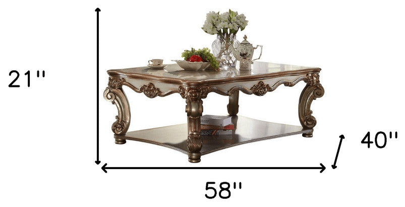 58" Gold Solid And Manufactured Wood Coffee Table With Shelf