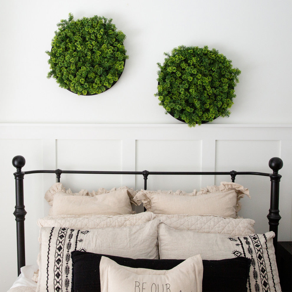 Lifestyle: two moss panels shown on wall above bed in bedroom.