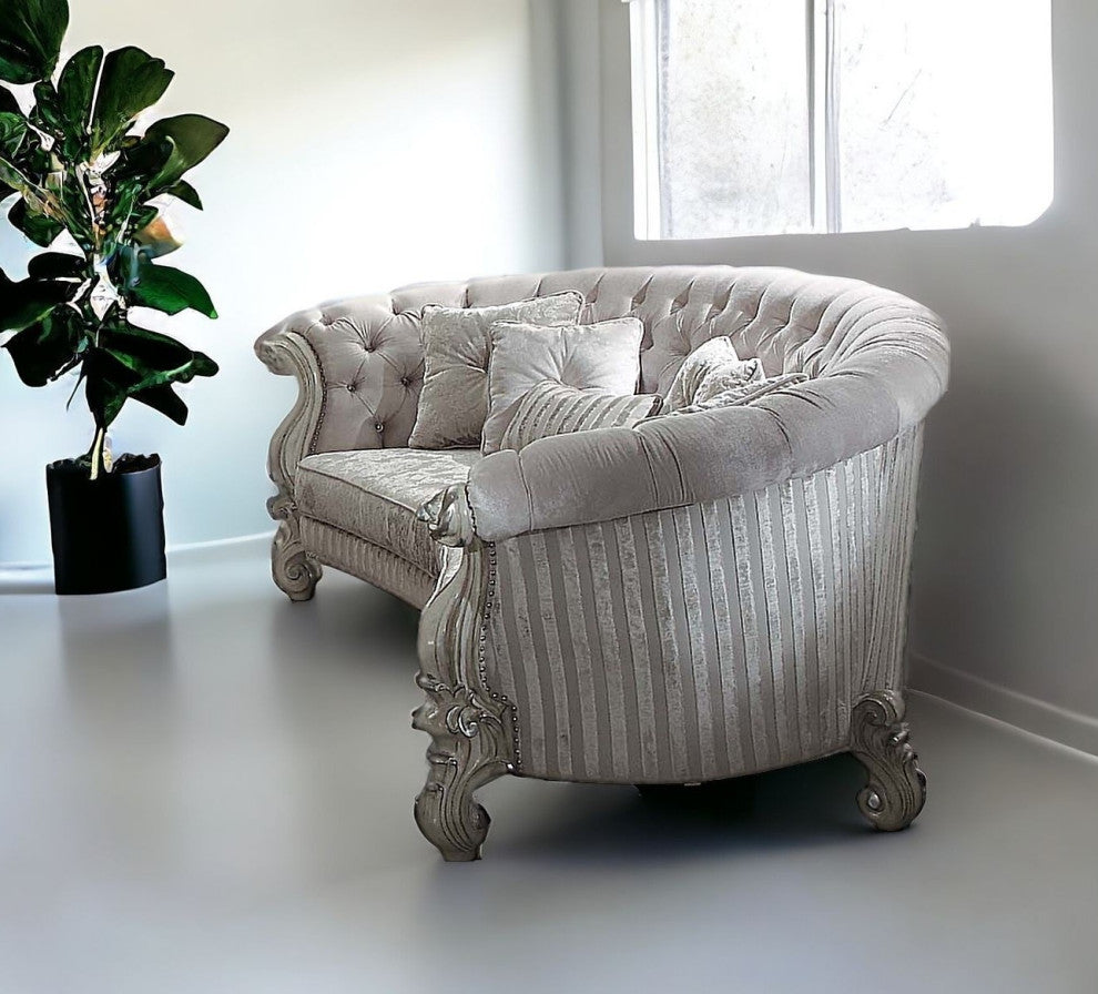55" Ivory Velvet Curved Floral Sofa And Toss Pillows With Gray Legs