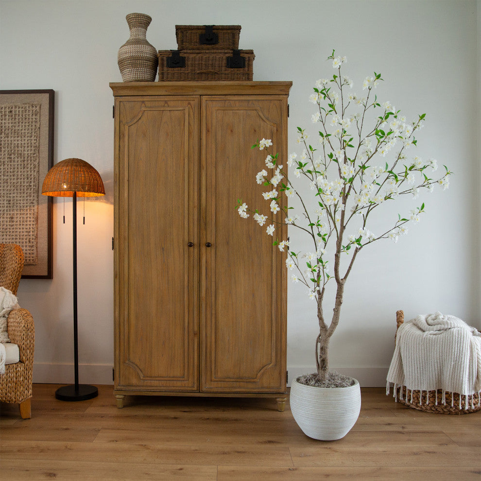 Full tree shown in a real room setting with furniture; lifestyle context.