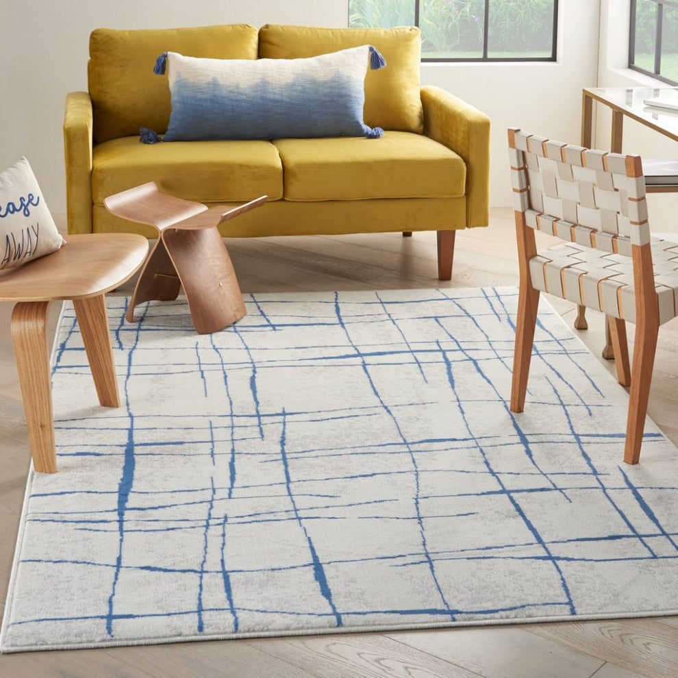 6' X 9' Blue And Ivory Abstract Dhurrie Area Rug
