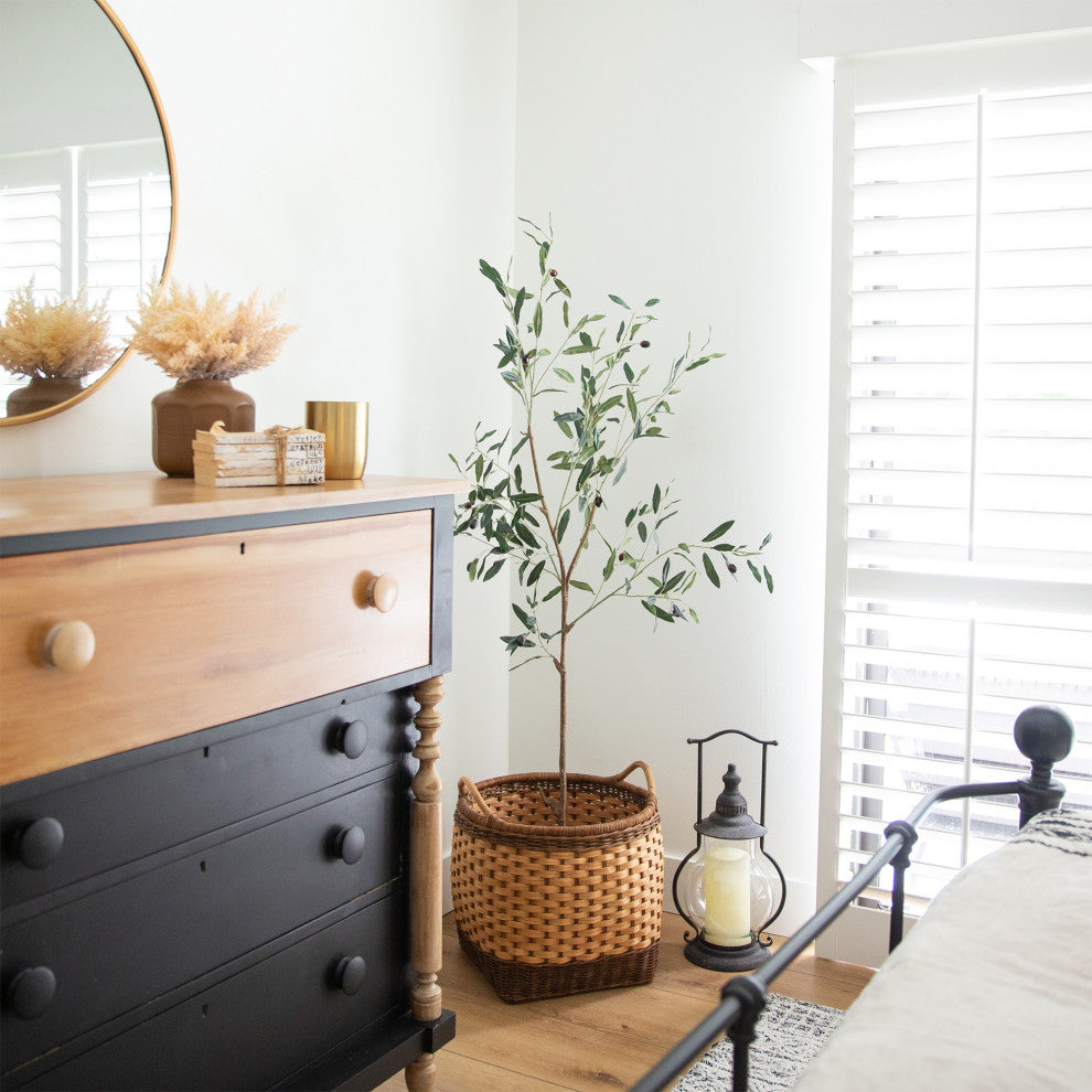 Lifestyle setting; tree placed in room; full product visible.