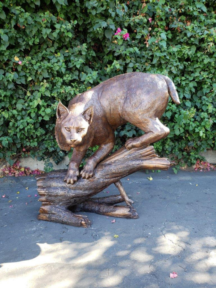 Bobcat Going Down a Tree Log Bronze Statue -  Size: 43"L x 25"W x 41"H.