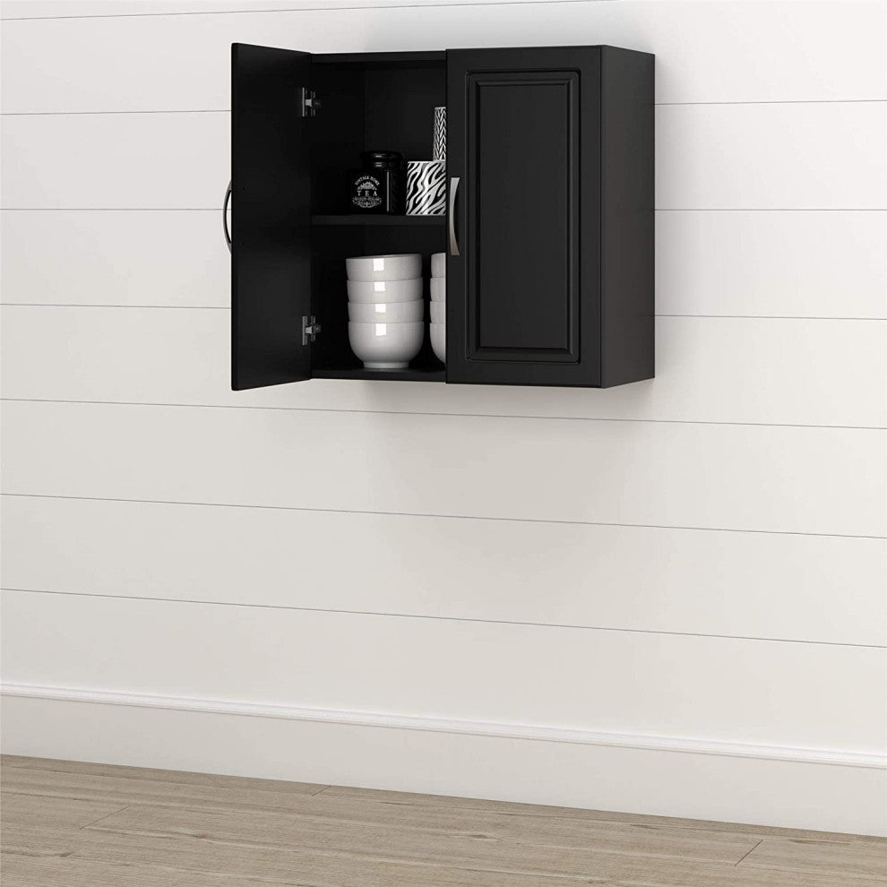 Lifestyle image: wall-mounted cabinet shown in a real room with opened door for context.
