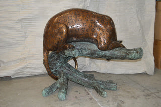 Leopard on a Tree Trunk Bronze Statue -  Size: 38"L x 34"W x 36"H.