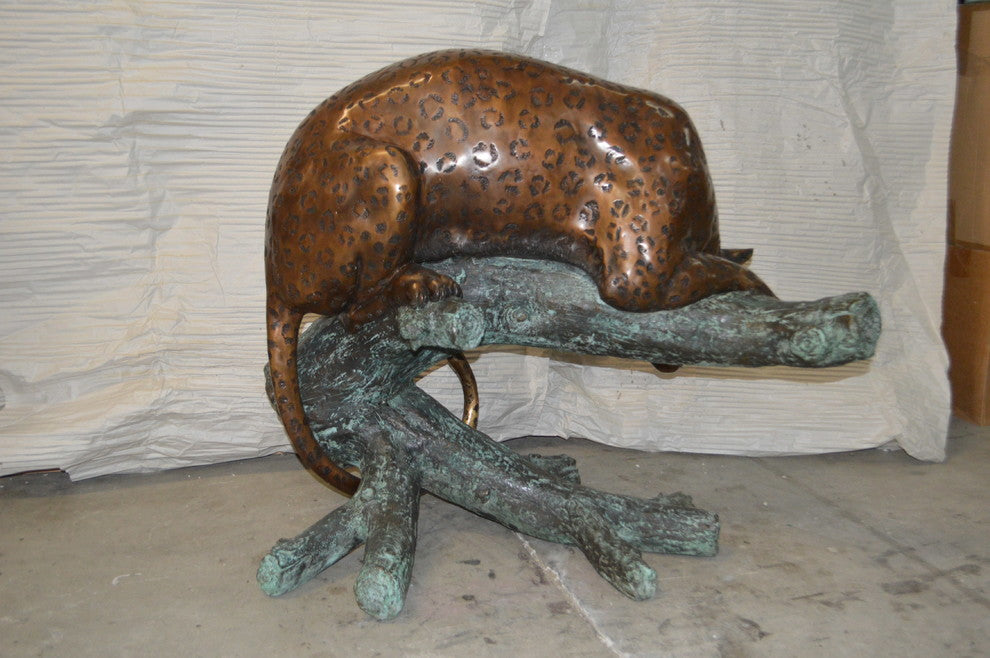 Leopard on a Tree Trunk Bronze Statue -  Size: 38"L x 34"W x 36"H.