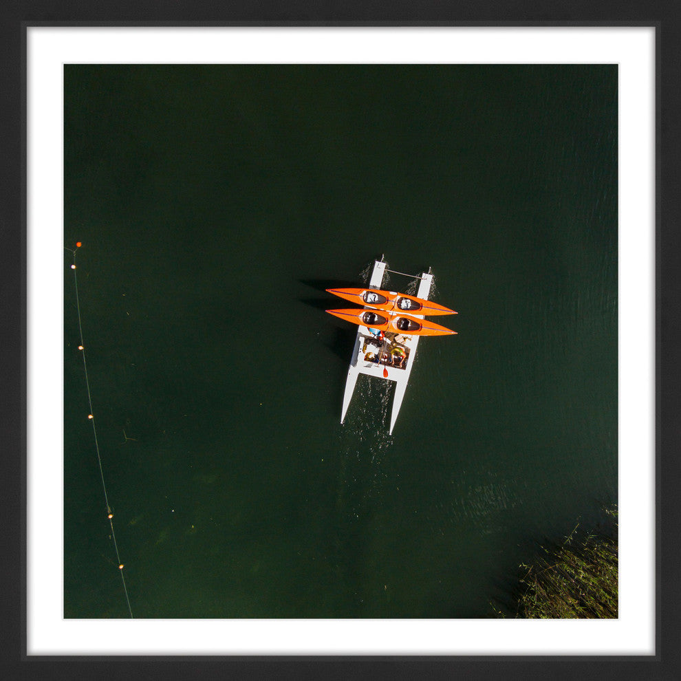"Orange Kayaks" Framed Print by Karolis Janulis