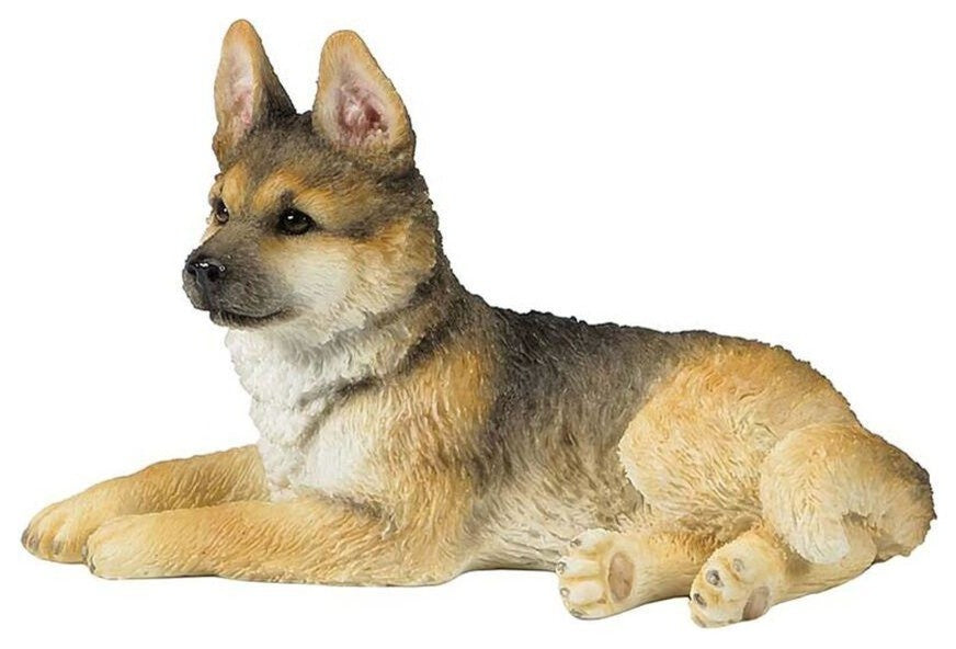 German Shepherd Puppy Sitting and Looking Towards Left