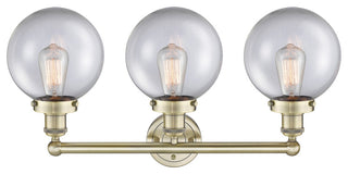 Edison Large Beacon 3-Light 25" Vanity Light, Antique Brass Finish, Clear Shade
