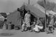 Refugee Family in Migrant Camp - Gallery Wrapped Canvas Art 28" x 42"