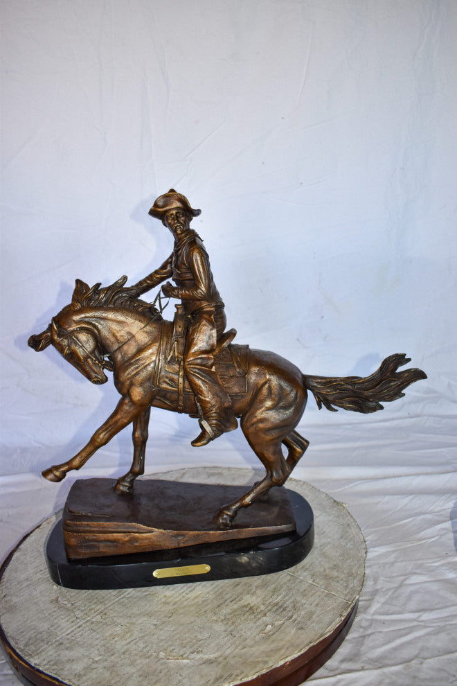 Cowboy Remington Replica Bronze Statue on Triple Marble Size: 25" x 8" x 24"H
