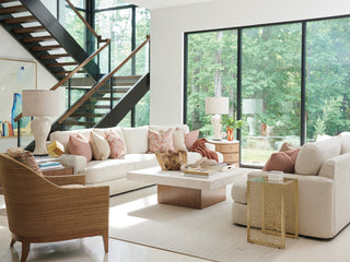Lifestyle shot in a real living room environment; shows the table in-use with surrounding furniture.