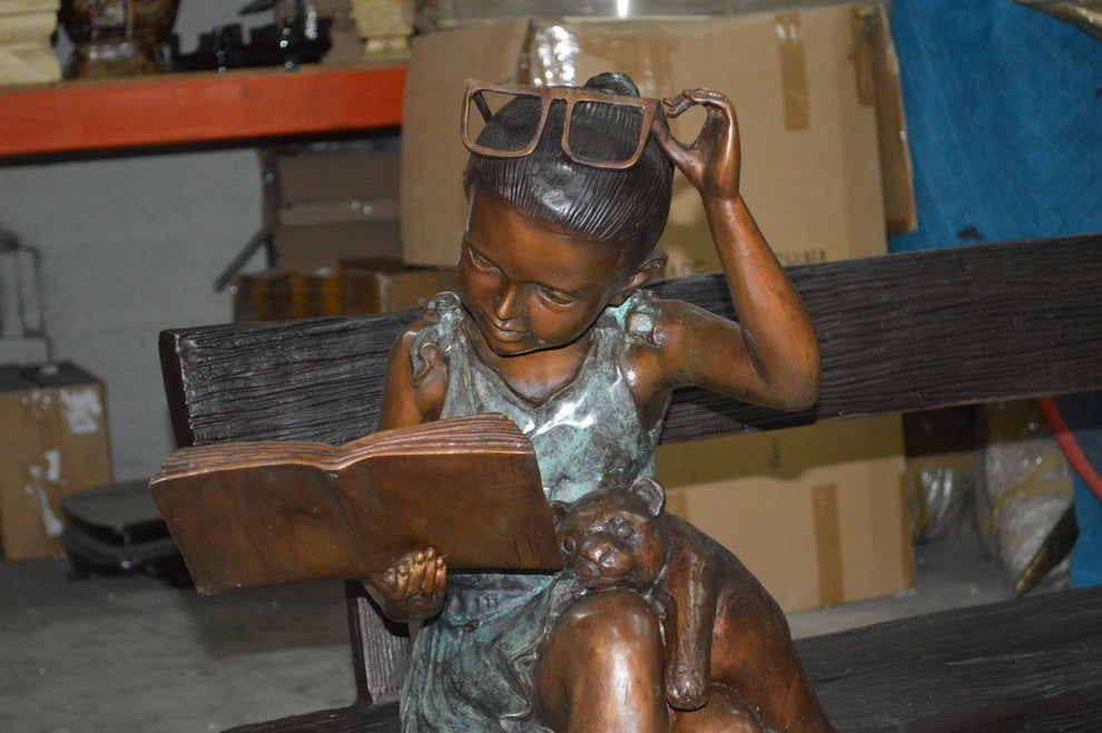 Girl with Glasses on Bench  Bronze Statue -  Size: 43"L x 20"W x 36"H.