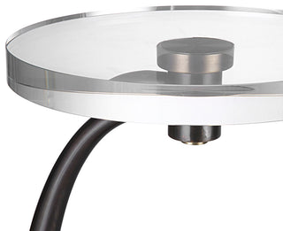 Close-up of the glass top and mounting against white background.