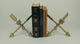 Vintage Gold Cast Iron Crossed Arrows Table Sculptures or Bookends Set of 2