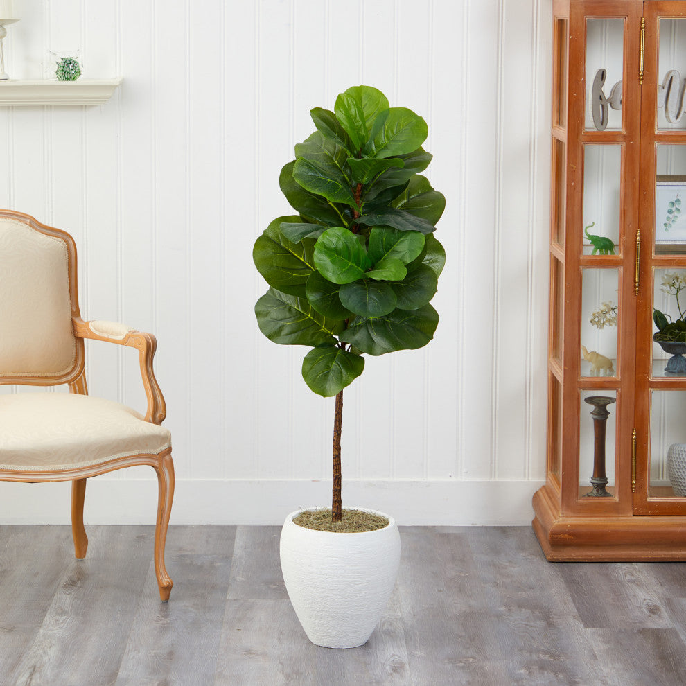 Lifestyle image showing the tree in another indoors setting with furniture.