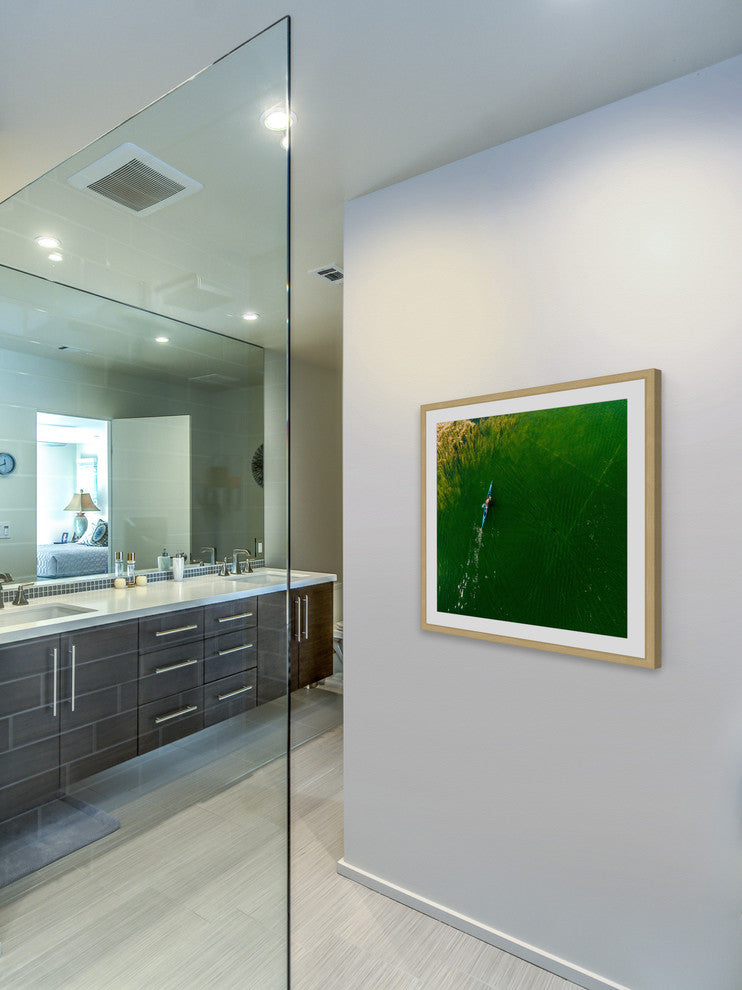 "Blue Canoe" Framed Print by Karolis Janulis