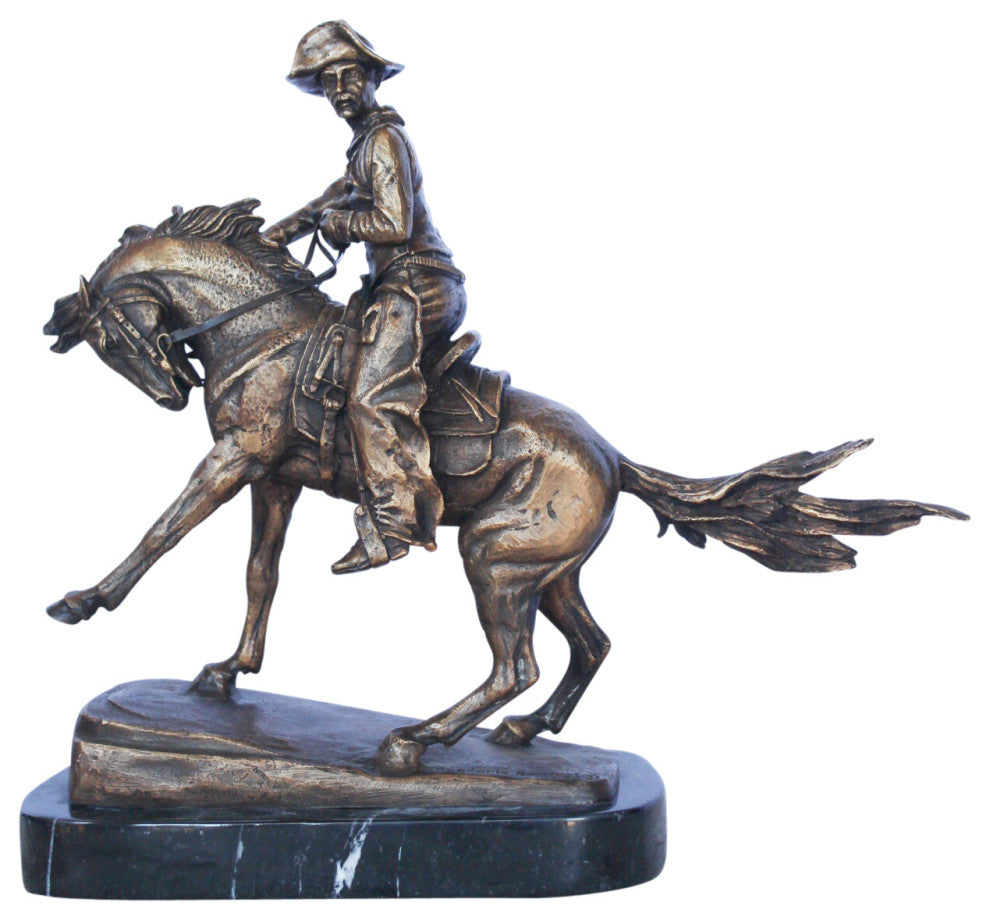Remington replica Cowboy bronze statue -  Size: 5"L x 15"W x 13"H.