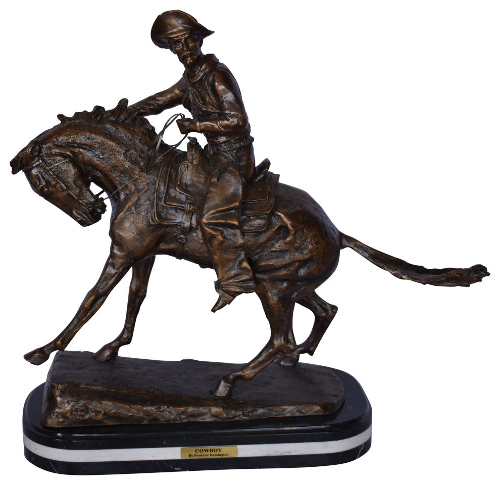 Remington Cowboy Replica Bronze Statue on Triple Marble Size: 8"x 26"x 23"H.