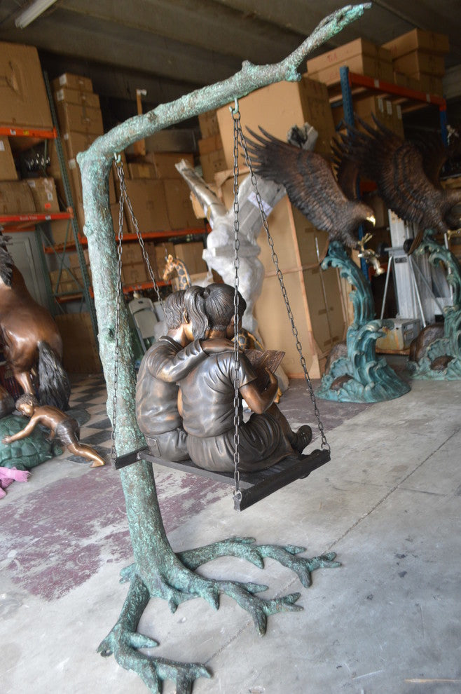 Kids on Swing Set Reading a Book Life Size Bronze Statue -  50"L x 40"W x 70"H