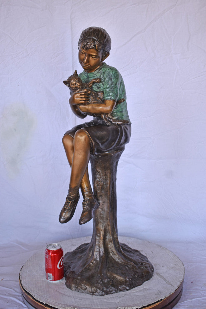 Girl Sitting on A Log With Her Cat Bronze Statue Size: 15"L x 15"W x 35"H.