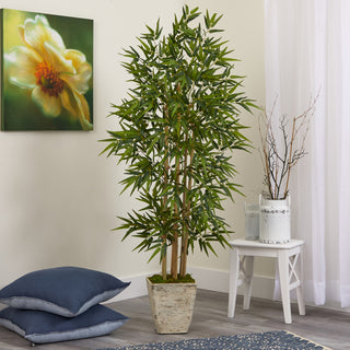 Lifestyle image: shows the bamboo tree in a real room setting with decor; background is not plain white and the product is fully visible within a scene.
