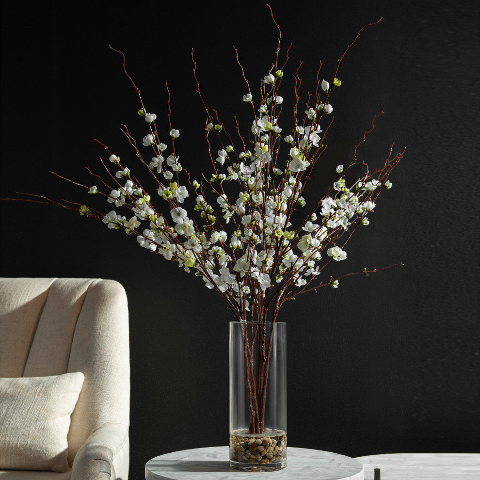 Lifestyle image featuring a tall vase arrangement in a home setting; non-white background and real environment.