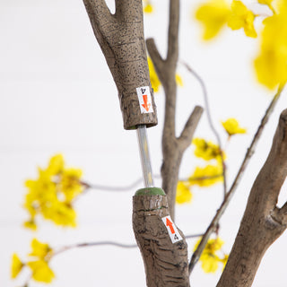 White background close-up with arrows/labels indicating assembly or adjustment (instructional)